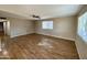 Spacious living room with hardwood floors and ceiling fan at 660 W 22Nd Ave, Apache Junction, AZ 85120