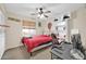 Bedroom with red bedding, a desk, and built-in shelving at 7337 W Claremont St, Glendale, AZ 85303