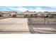 Ranch style home with a large driveway and gated entrance at 7337 W Claremont St, Glendale, AZ 85303