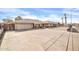 Front view of a single-story home with a large driveway at 7337 W Claremont St, Glendale, AZ 85303