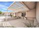 Home exterior featuring a pergola and well-maintained landscaping at 7337 W Claremont St, Glendale, AZ 85303