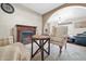 Living room with a fireplace and a comfortable armchair at 7337 W Claremont St, Glendale, AZ 85303