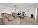 Living room with brown sofas and a wood-framed TV at 7337 W Claremont St, Glendale, AZ 85303