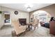 Charming sitting area with fireplace and comfortable armchairs at 7337 W Claremont St, Glendale, AZ 85303