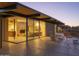 Mid-century modern home with glass walls and desert landscaping at 7724 E Long Rifle Rd, Carefree, AZ 85377