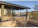 Mid-century modern home exterior with covered patio and desert landscaping at 7724 E Long Rifle Rd, Carefree, AZ 85377