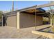 Attached garage with modern dark gray door and paver driveway at 7724 E Long Rifle Rd, Carefree, AZ 85377