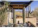 Landscaped patio area with cacti and mountain backdrop at 7724 E Long Rifle Rd, Carefree, AZ 85377