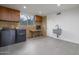 Laundry room with modern appliances and built-in cabinets at 7724 E Long Rifle Rd, Carefree, AZ 85377