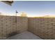 Private patio with brick walls and mountain views at 7724 E Long Rifle Rd, Carefree, AZ 85377