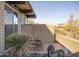 Mid-century modern patio with rocking chairs and landscaping at 7724 E Long Rifle Rd, Carefree, AZ 85377