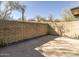 Landscaped patio area with brick wall and desert plants at 7724 E Long Rifle Rd, Carefree, AZ 85377