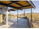 Mid-century modern patio with covered area and mountain view at 7724 E Long Rifle Rd, Carefree, AZ 85377