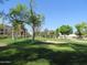 Landscaped courtyard with grassy areas and mature trees at 7930 E Camelback Rd # 509, Scottsdale, AZ 85251