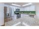 A close-up view of the stainless steel refrigerator, oven, microwave, and light granite countertops at 7930 E Camelback Rd # 509, Scottsdale, AZ 85251