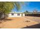 Spacious backyard with gravel landscaping and fire pit at 8215 E 2Nd Ave, Mesa, AZ 85208