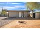 Backyard with fire pit and detached shed at 8215 E 2Nd Ave, Mesa, AZ 85208