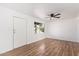 Bright living room featuring hardwood floors and a ceiling fan at 8215 E 2Nd Ave, Mesa, AZ 85208