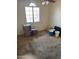 Empty bedroom with ceiling fan, arched window, and neutral walls at 8501 W Vernon Ave, Phoenix, AZ 85037