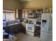 Kitchen with wood cabinets and granite countertops at 8501 W Vernon Ave, Phoenix, AZ 85037