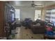 Living room with tiled floor and brown couch at 8501 W Vernon Ave, Phoenix, AZ 85037