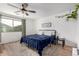 Bright bedroom with a king-size bed and wood flooring at 851 E Bradstock Way, San Tan Valley, AZ 85140