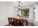 Simple dining area with a wooden table and two chairs at 851 E Bradstock Way, San Tan Valley, AZ 85140