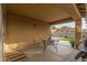 Covered patio with table and backyard view at 851 E Bradstock Way, San Tan Valley, AZ 85140