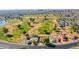 Aerial view showcasing a home's location near a golf course at 8539 W Lamar Rd, Glendale, AZ 85305