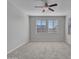 Bright bedroom with carpet flooring and ceiling fan at 8539 W Lamar Rd, Glendale, AZ 85305