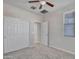 Bedroom with double door closet and carpet flooring at 8539 W Lamar Rd, Glendale, AZ 85305