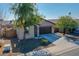 One-story home with a two-car garage and desert landscaping at 8539 W Lamar Rd, Glendale, AZ 85305