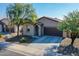 One-story home with a two-car garage and desert landscaping at 8539 W Lamar Rd, Glendale, AZ 85305