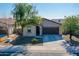 One-story home with a two-car garage and desert landscaping at 8539 W Lamar Rd, Glendale, AZ 85305