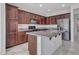 Kitchen boasts granite countertops and dark wood cabinetry at 8539 W Lamar Rd, Glendale, AZ 85305