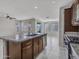 Spacious kitchen island with granite countertop and breakfast bar at 8539 W Lamar Rd, Glendale, AZ 85305