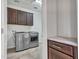 Laundry room with modern washer, dryer, and cabinets at 8539 W Lamar Rd, Glendale, AZ 85305