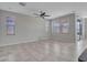 Spacious living room with tile floors and multiple windows at 8539 W Lamar Rd, Glendale, AZ 85305