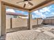 Covered patio with brick flooring and a fire pit at 8539 W Lamar Rd, Glendale, AZ 85305