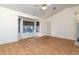 Bright dining room with wood-look flooring and access to backyard at 9007 E Emerald Dr, Sun Lakes, AZ 85248