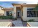 Front entry with decorative wrought iron door at 9007 E Emerald Dr, Sun Lakes, AZ 85248