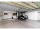 Spacious two-car garage with built-in cabinets and shelving at 9007 E Emerald Dr, Sun Lakes, AZ 85248