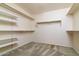 Large walk-in closet with shelving and hanging rods at 9007 E Emerald Dr, Sun Lakes, AZ 85248