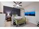 Spacious bedroom with a four-poster bed and a ceiling fan at 920 E Devonshire Ave # 4005, Phoenix, AZ 85014