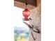 Hummingbird feeder with dragonfly art on a balcony at 920 E Devonshire Ave # 4005, Phoenix, AZ 85014