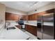 Updated kitchen with stainless steel appliances and wood cabinets at 920 E Devonshire Ave # 4005, Phoenix, AZ 85014