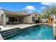 Gorgeous backyard pool with a sauna and inviting outdoor dining area at 9248 E Desert Village Dr, Scottsdale, AZ 85255