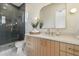 Stylish bathroom boasts modern vanity, gold fixtures, and sleek shower at 9248 E Desert Village Dr, Scottsdale, AZ 85255