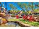 Inviting outdoor community space featuring a water feature, comfortable seating, and mature trees at 9248 E Desert Village Dr, Scottsdale, AZ 85255