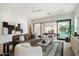 Modern living room with stylish furniture, large sliding doors, and plenty of natural light at 9248 E Desert Village Dr, Scottsdale, AZ 85255